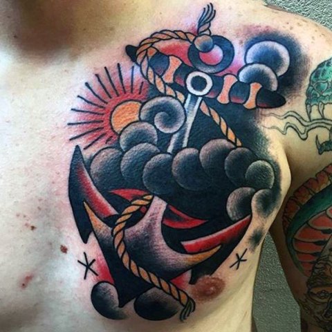 Sun and cloud tattoos on the left side of the chest