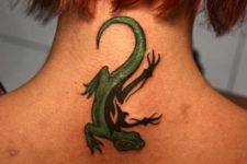 Green and black tattoo on the neck