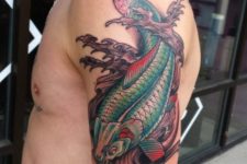 Green and red fish and waves tattoo