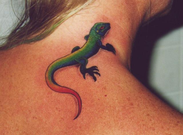 Green and red lizard tattoo on the neck and back