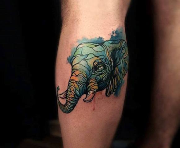 Green elephant head tattoo