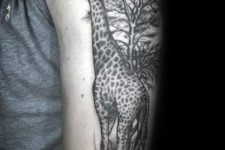 Half-sleeve giraffe and tree tattoo