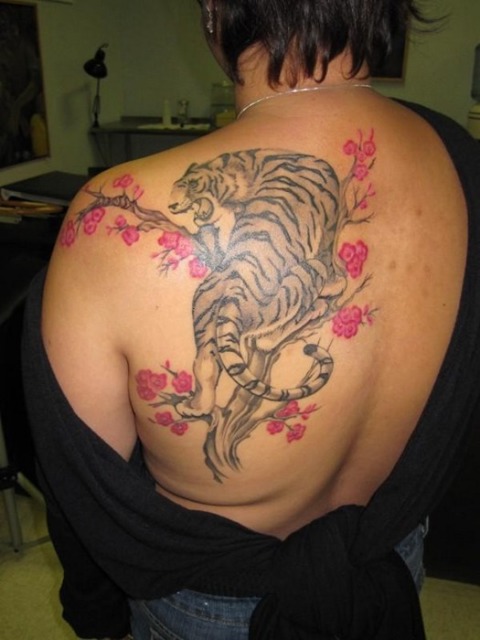 Large tiger and tree tattoo on the back