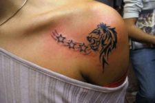 Lion and stars tattoo on the shoulder