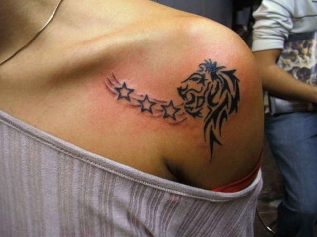 Lion and stars tattoo on the shoulder