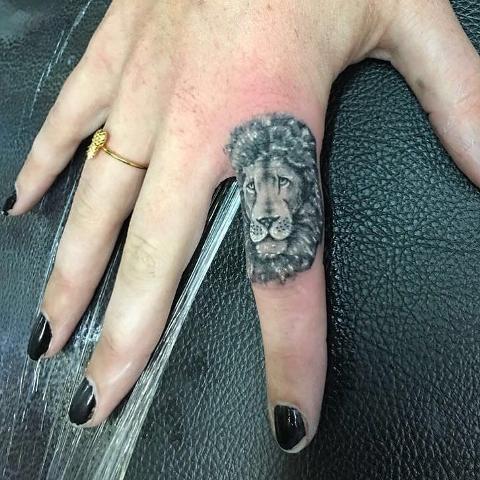 Lion tattoo on the finger