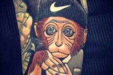 Monkey and hat tattoo