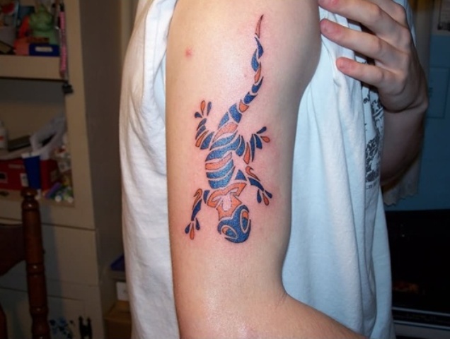 Orange and blue tattoo on the arm