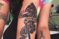 Panther and snake tattoo on the leg