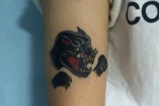 Panther head and paws tattoo