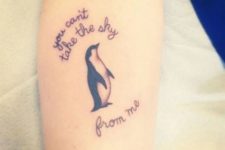 Penguin and phrase tattoo on the hand