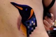 Penguin head tattoo on the back