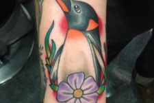 Penguin with flower tattoo