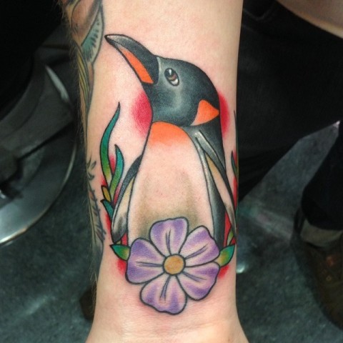 Penguin with flower tattoo