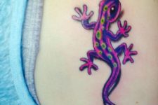 Purple and yellow tattoo on the shoulder
