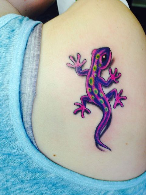 Purple and yellow tattoo on the shoulder