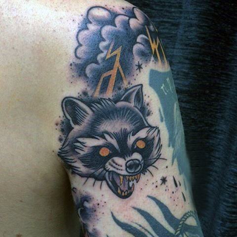 Raccoon and storm cloud tattoo