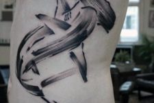 Schematic shark tattoo on the side
