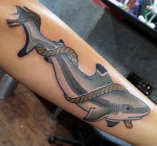 Shark and rope tattoo on the forearm
