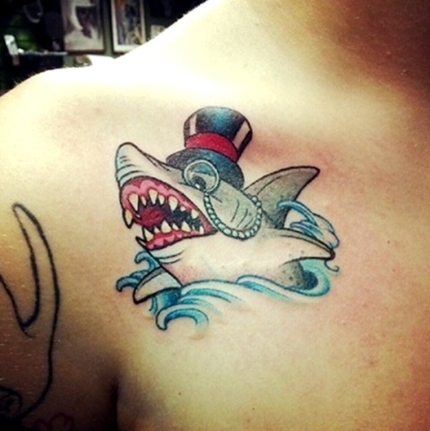 Shark with hat on the shoulder