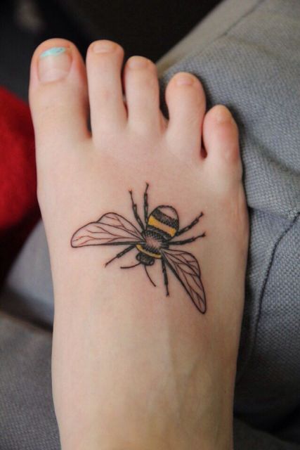 Simple bee tattoo on the foot