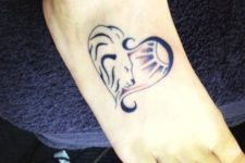 Small lion tattoo on the foot