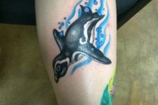 Swimming penguin tattoo