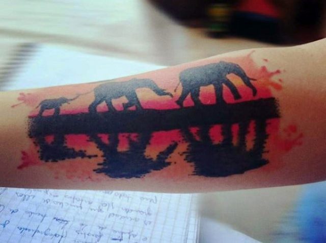 Three elephants tattoo on the arm