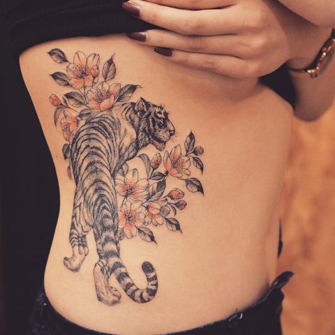 Tiger and flowers tattoo on the side