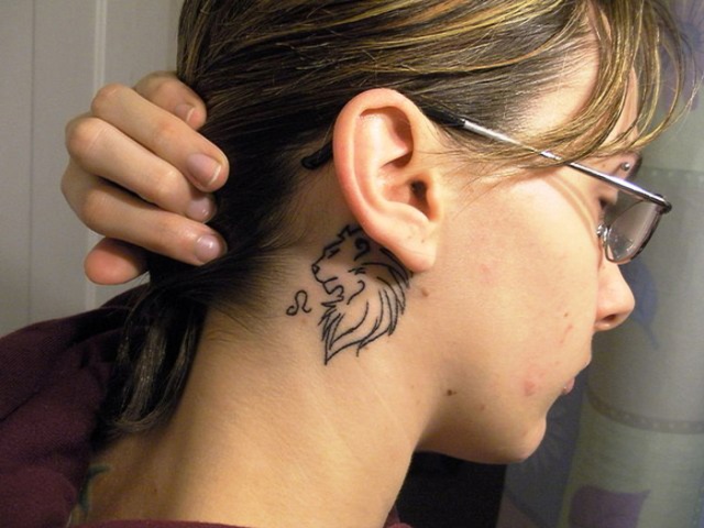 Tiny tattoo behind the ear