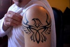 Tribal eagle tattoo on the shoulder