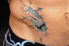 Unique blue clouds tattoo on the side