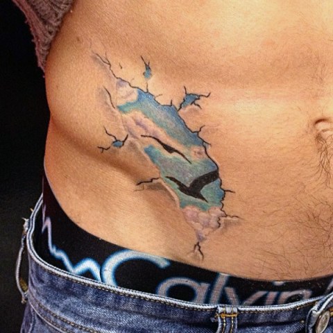 Unique blue clouds tattoo on the side