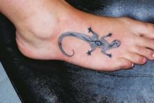 Unique gray tattoo on the foot