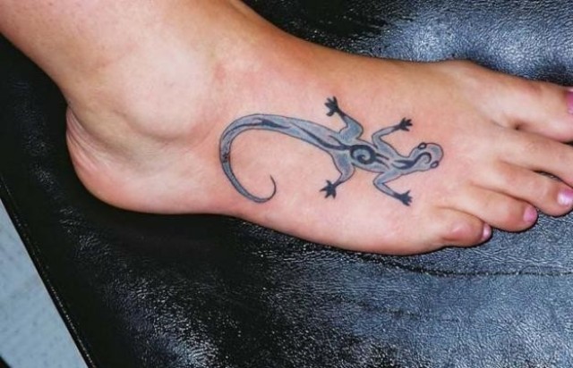 Unique gray tattoo on the foot