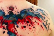 Watercolor blue and red tattoo on the back
