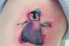 Watercolor penguin tattoo on the side