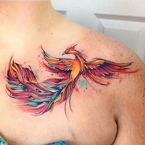 Watercolor tattoo on the collarbone
