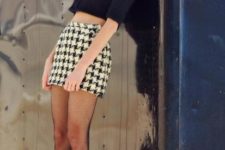 With mini skirt, crop shirt and white shoes