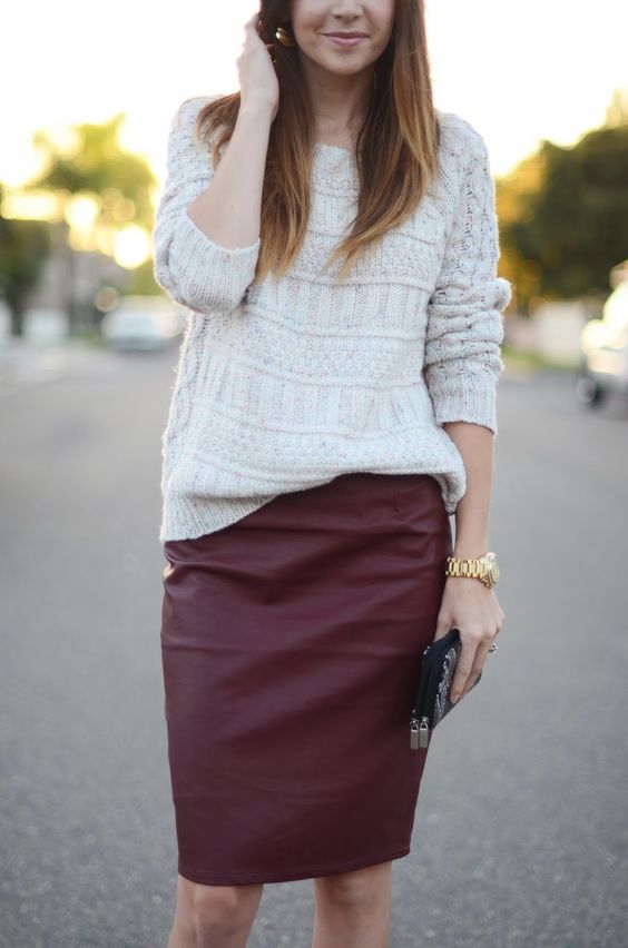 a white sweater and a burgundy leather pencil skirt create a comfy and girlish fall look