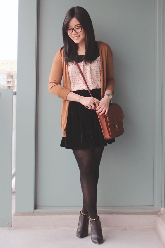 black pointed toe boots, black tights, a blush top, a black velvet skirt and a long cardigan