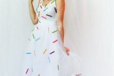 03 an ice-cream cone costume of a flowy white sleeveless dress with cofetti attaached, white shoes and a cone hat