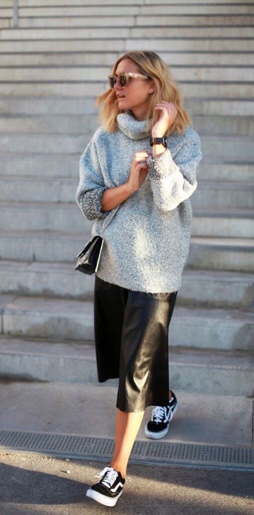 a black midi skirt, a grey oversized sweater and black Vans sneakers for a comfy look