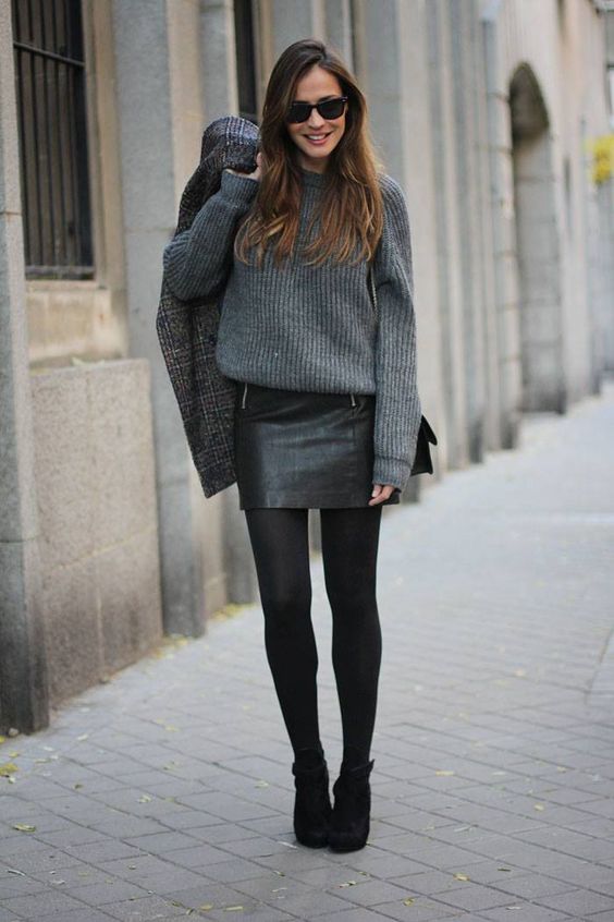 a grey sweater, a black mini skirt, black tights and black suede booties for a cute look