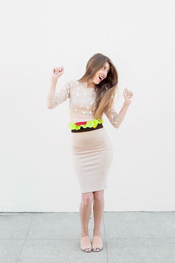 burger costume of a tan dress with a colorful belt, nude shoes