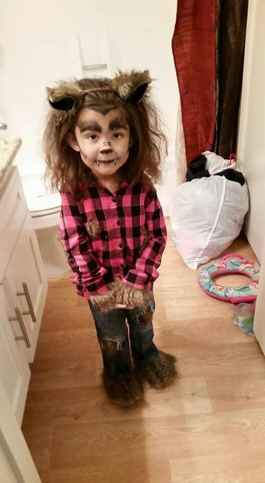 girly werewolf costume and makeup with ears and faux fur decorated clothes