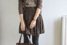 a brown floral skirt, black tights, brown booties, a neutral top and a brown cardigan for a vintage-inspired look