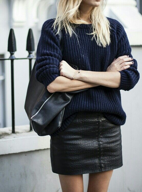 a navy sweater and a black leather textural mini is a chic and sexy combo
