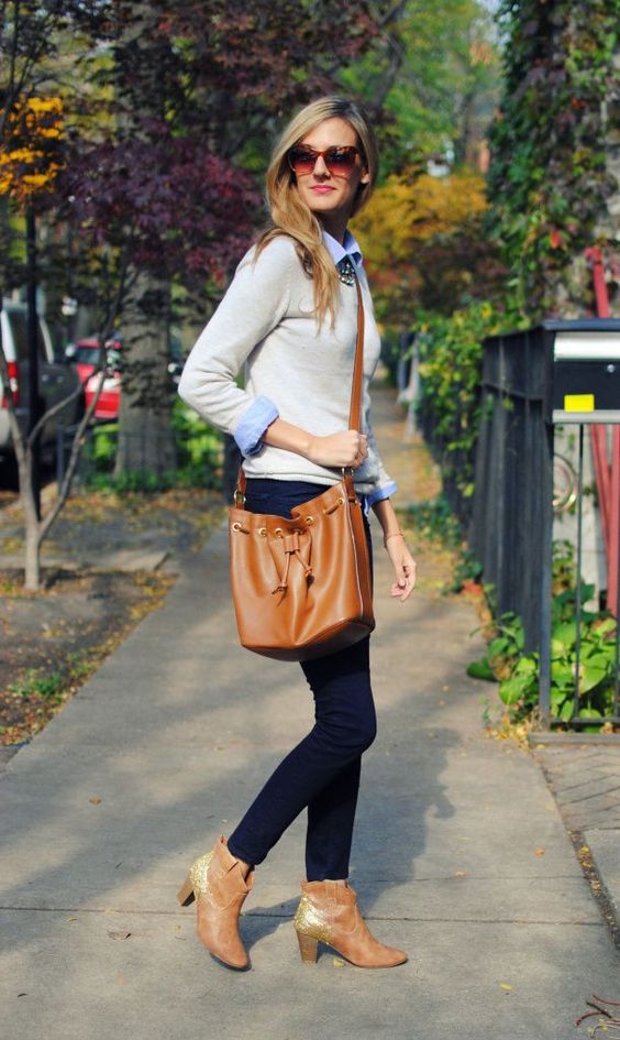 navy jeans, a neutral jumper over a blue shirt, amber booties and a bag
