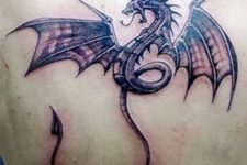 Angry dragon tattoo on the back